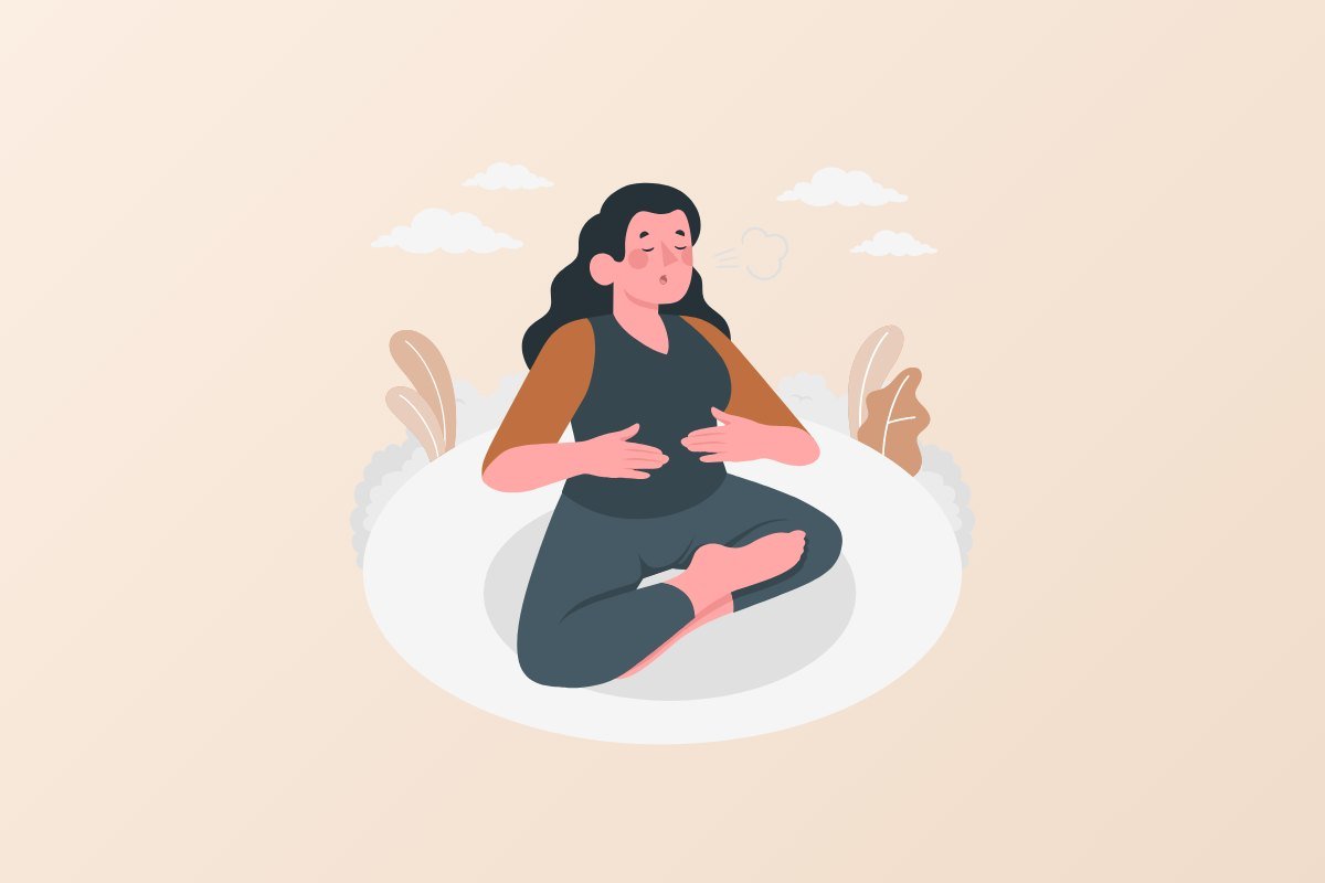 Woman sitting cross-legged practising breathing exercises